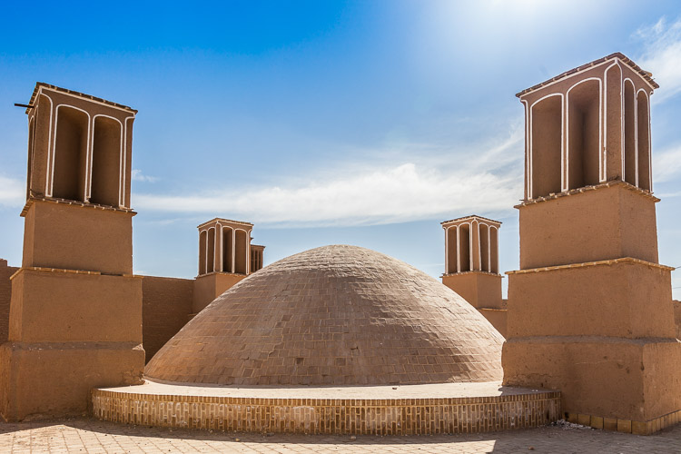 A water reservoir with 4 badgirs (cooling towers / windcatcher). With an extremely hot climate, this is the way how Iranians for centuries have been using the wind as a natural air-conditioning.