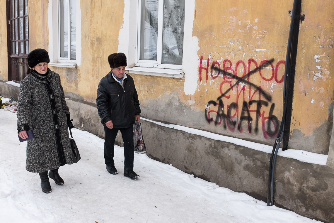Red graffiti: 'Novorossia to be' - in black: 'sucks'