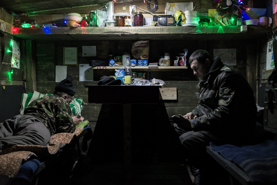 Soldiers are relaxing inside their barrack at a checkpoint