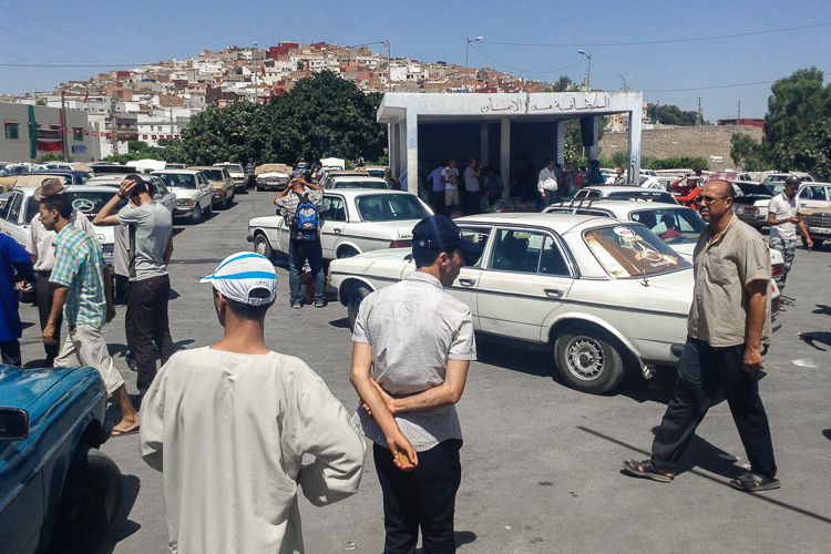A (shared) taxi rank in Northern Morocco; a special form of public transport that only leaves when it's full.