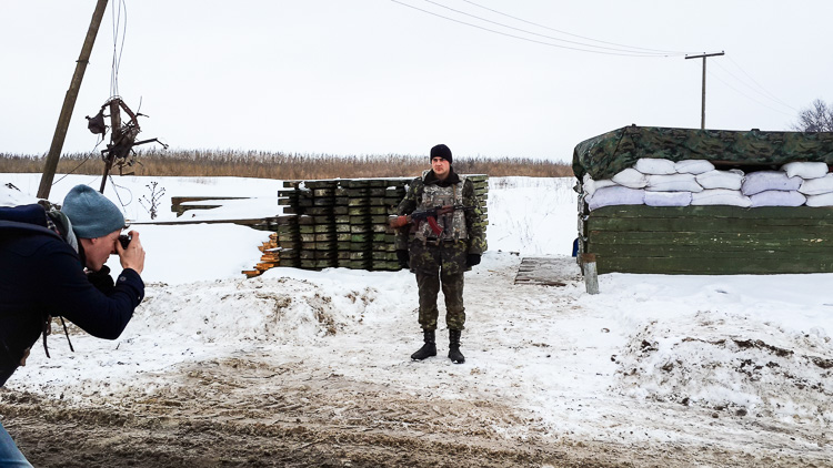 Photographing a soldier at a checkpoint near the former separatist stronghold Sloviansk, Ukraine