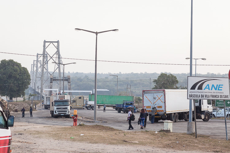 7:00 AM, trucks are starting to make their way across the bridge before lining up in a column to traverse the Save-Muxungue road