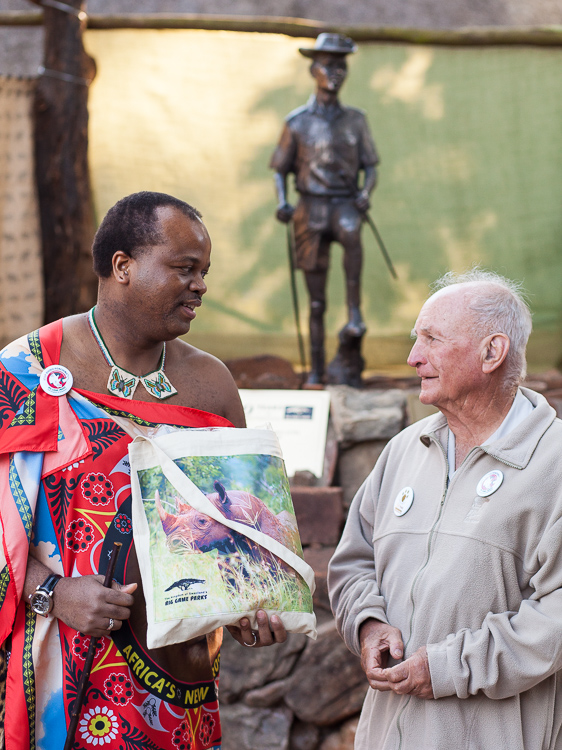 Ted Reilly and Mswati III just unveiled the statue of a ranger behind them