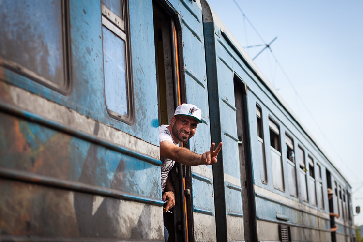 A young man smiles as he is on his way to Tabanovce