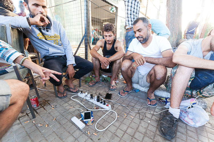 People are charging their phones. One of the main reasons why people are now travelling towards the EU is that the information on Facebook has improved a lot. There are many Facebook pages in Arabic with information on how to contact smugglers, telephone numbers, routes, time tables boats, etc.