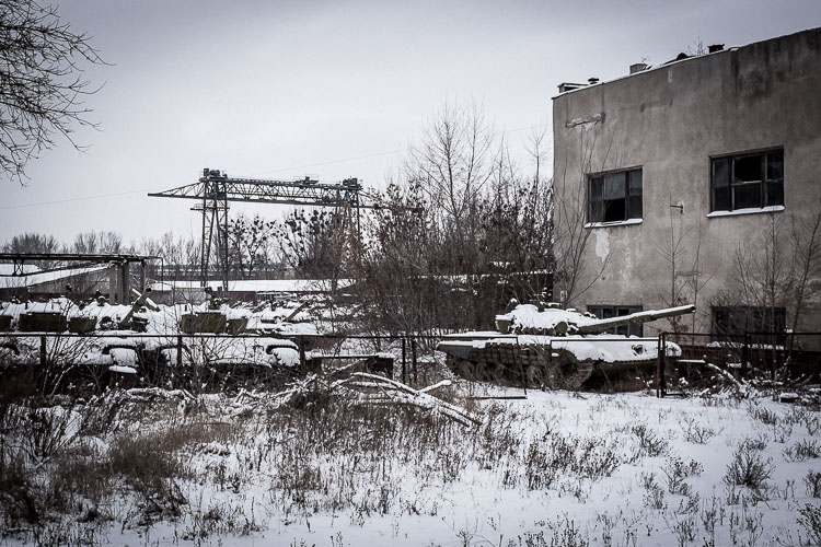 Dozens of old Soviet tanks lay to rust, awaiting a new life.