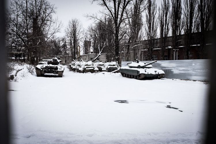 Dozens of old Soviet tanks were rusting away in the snow.