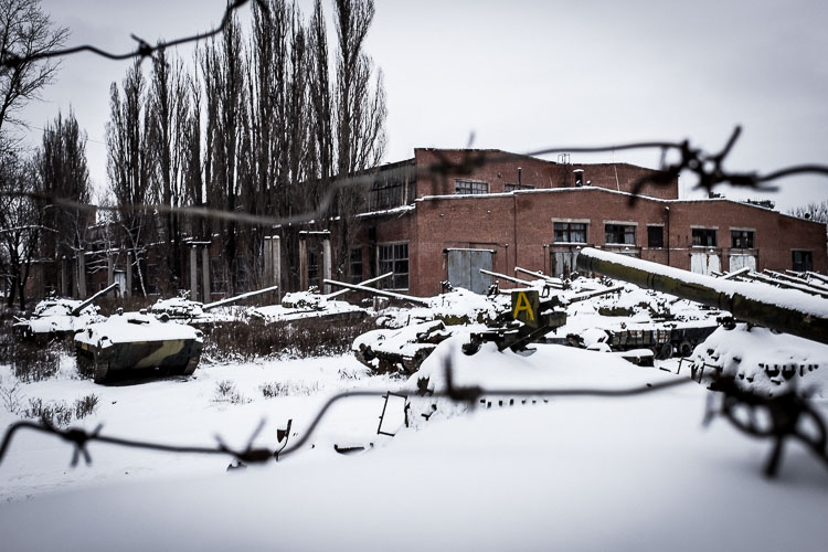 Dozens of old Soviet tanks were rusting away in the snow.